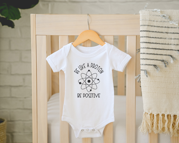 BE LIKE A PROTON BE POSITIVE Funny baby onesies Nerdy bodysuit (white: short or long sleeve)