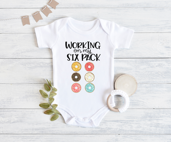 WORKING ON MY SIX PACK funny baby onesies donut bodysuit (white: short or long sleeve) - HappyAddition
