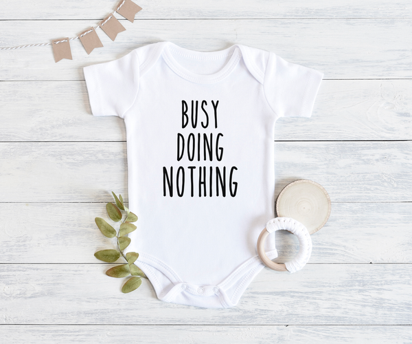 BUSY DOING NOTHING Funny baby onesies bodysuit (white: short or long sleeve) - HappyAddition